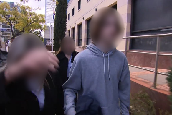 The teenager leaving Perth Children’s Court with his family in July.