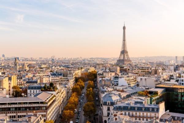 Paris skyline with Eiffel Tower at sunset, aerial view, France