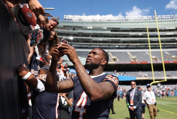 Bears safety Eddie Jackson signs autographs after a 23-17 win over the Titans in a preseason game at Soldier Field on Aug. 12, 2023.