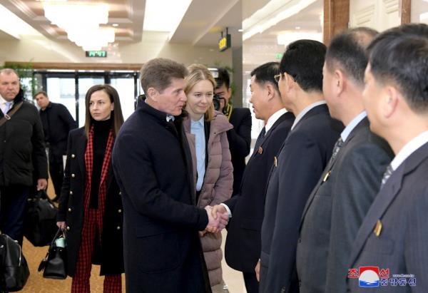 Oleg Kozhemyako (left from center), governor of the Russian far eastern region of Primorsky Krai that borders North Korea, shakes hands with North Korean officials during his visit to Pyo<em></em>ngyang on Tuesday. (KCNA)