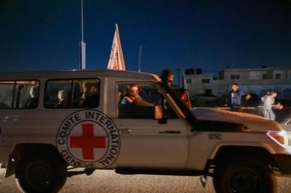 An Internatio<em></em>nal Red Cross vehicle reportedly carrying hostages released by Hamas crosses the Rafah border point in the Gaza Strip towards Egypt from wher<em></em>e they would be flown to Israel to be reunited with their families, on November 24, 2023. — AFP pic