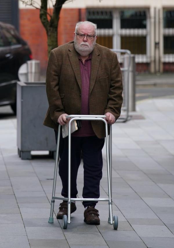 Flowers arrived at the last court hearing with the assistance of a wheeled Zimmer f<em></em>rame (Picture: PA)