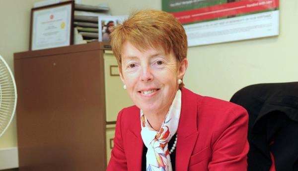 Paula Vennells sitting at her desk. 