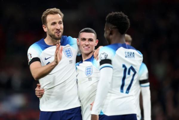 arry Kane of England (L) celebrates with teammates Bukayo Saka and Phil Foden after scoring the team's second goal during the UEFA EURO 2024 European qualifier match between England and Malta at Wembley Stadium.