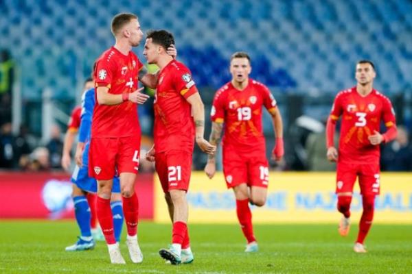 Jani Atanasov of North Macedo<em></em>nia celebrates with Nikola Serafimov after scoring second goal during the UEFA EURO 2024 European qualifier match between Italy and North Macedo<em></em>nia at Stadio Olimpico.