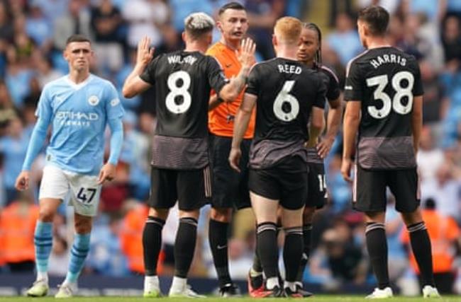 Fulham’s Harry Wilson, Harrison Reed and Luke Harris appeal to Michael Oliver for offside against Manuel Akanji on Nathan Aké’s goal