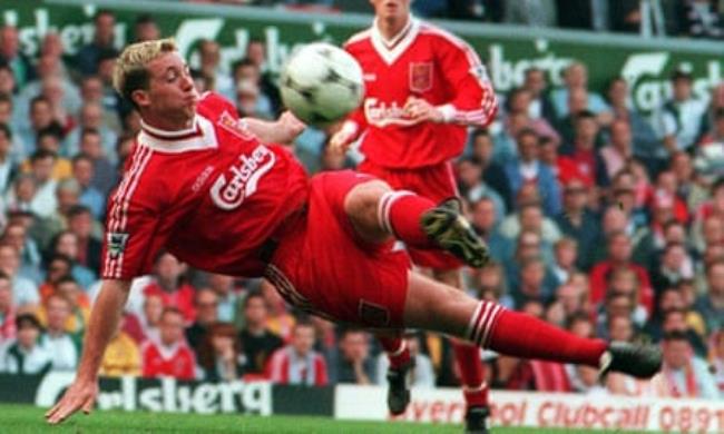 Robbie Fowler in flying action for Liverpool against Bolton.