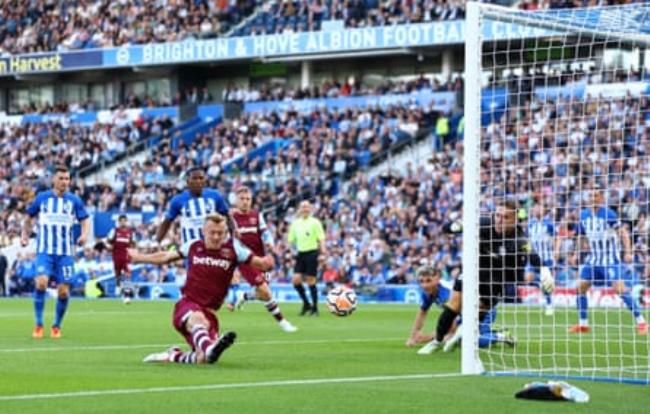 James Ward-Prowse watches his shot head towards the back of the Brighton net to give West Ham the lead.