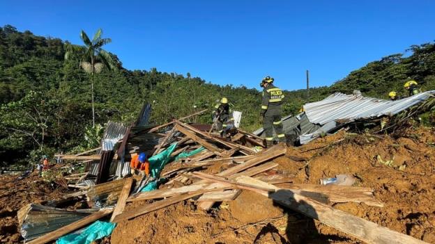 Rescue workers search for survivors of a mudslide in Colombia's Choco province.