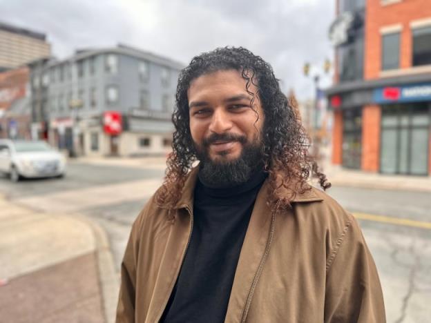 Man stands on city street