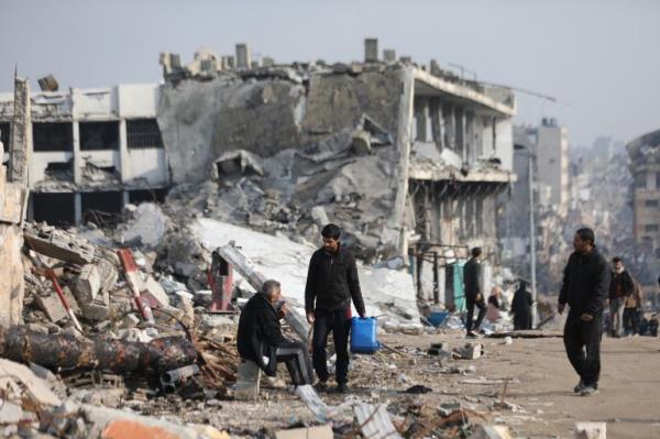 Two men standing desolately in the ruins