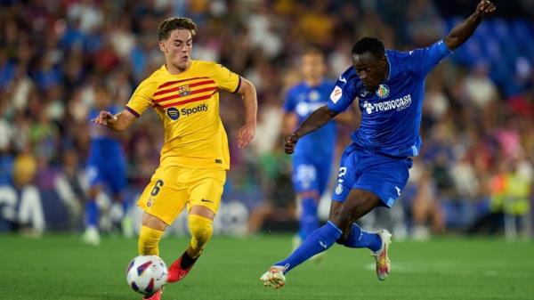 Gavi of FC Barcelona competes for the ball with Djene Dako<em></em>nam of Getafe CF