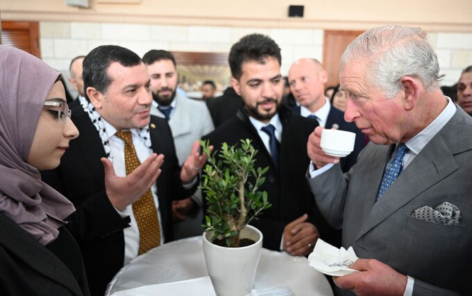 The King speaks to Palestinian refugees in Bethlehem on his tour of the region in 2020