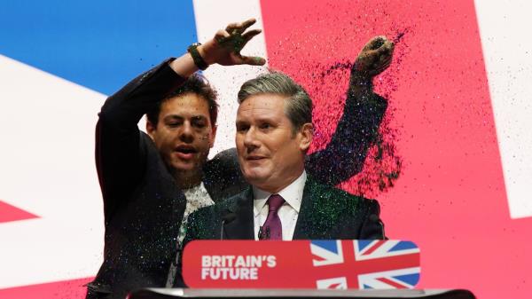 A protestor throws glitter over Labour party leader, Keir Starmer during the leader's speech at the Labour Party co<em></em>nference on October 10, 2023 in Liverpool, England. 