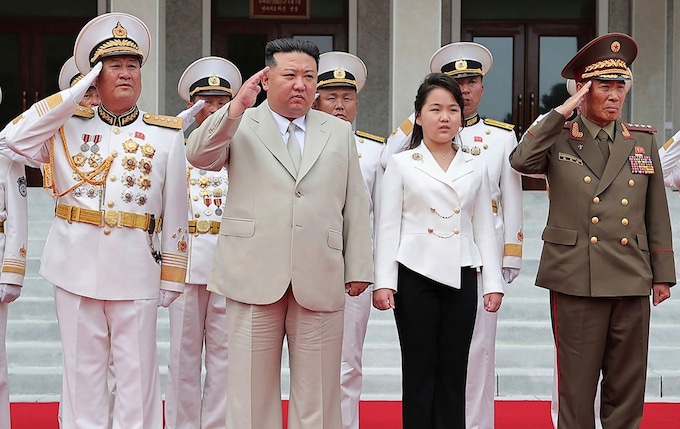 Kim Jong Un, with his daughter, reviews the ho<em></em>nour guard during their visit to the Navy headquarters