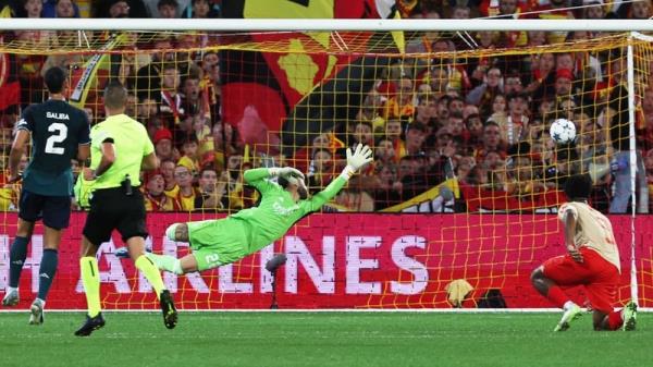 Adrien Thomasson scores Lens' first goal past David Raya in the Arsenal goal