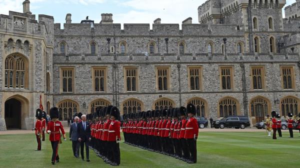 The pair inspect an ho<em></em>nor guard formed by the Welsh Guards, during a ceremo<em></em>nial welcome in the Quadrangle at the royal residence. 