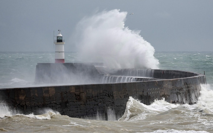 Newhaven Lighthouse, near Edinburgh is buffeted by Storm Antoni