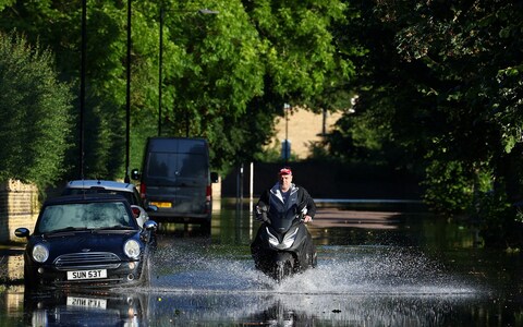 The River Thames in West Lo<em></em>ndon overspills its banks after Storm Antoni