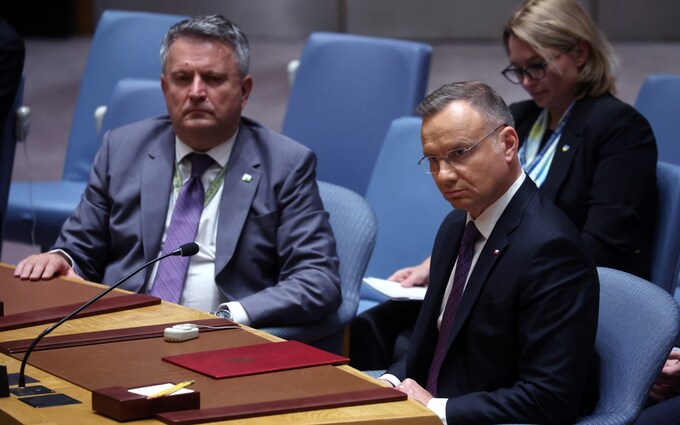 Poland's President Andrzej Duda sits next to Ukraine's Ambassador to the United Nations Sergiy Kyslytsya