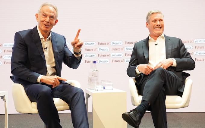 Tony Blair (left) speaks with Labour leader Sir Keir Starmer during the Tony Blair Institute for Global Change's Future of Britain Co<em></em>nference in July this year