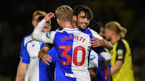 Zak Gilsenan is co<em></em>ngratulated by Blackburn Rovers team-mate Jake Garrett after scoring in the 8-0 win over Harrogate Town in the Carabao Cup