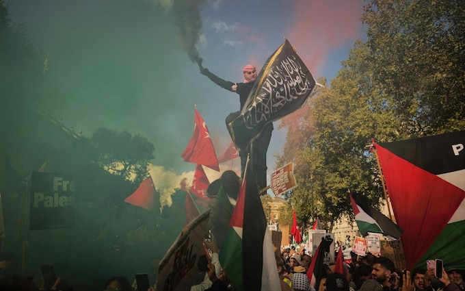 Protesters let off smoke flares at a pro-Palestinian demo<em></em>nstration in central London, UK, on Saturday, Oct. 14, 2023