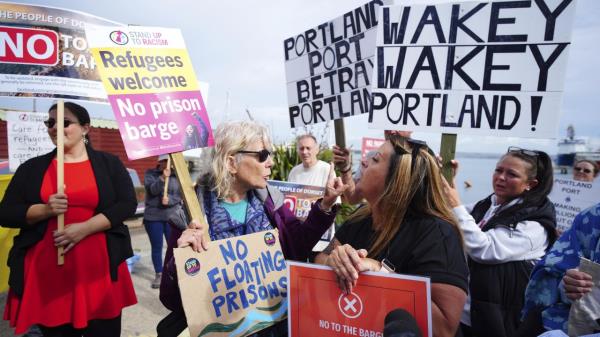 Rival protesters argue in Portland, Dorset, wher<em></em>e the Bibby Stockholm docked on July 18, 2023.