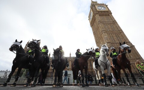 Police officers mo<em></em>nitoring the march in London