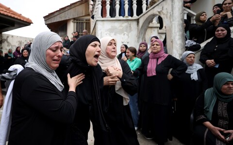 Mourners attend the funeral ceremony of 30 year-old Palestinian Nasser Abdullatif al-Bergusi, who was wounded during the Israeli raid and later killed in a hospital, in Beit Rima town of Ramallah, West Bank on Sunday