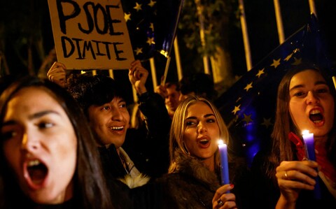 Supporters of Alejo Vidal-Quadras hold candles in his ho<em></em>nour after the assassination attempt 