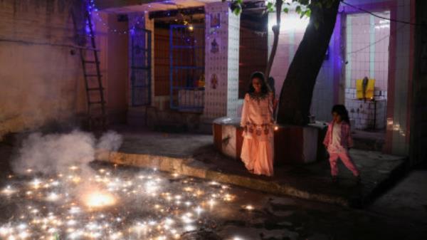 Children light fireworks to celebrate Diwali, the Hindu festival of lights, in New Delhi, India, November 12, 2023. REUTERS/Anushree Fadnavis