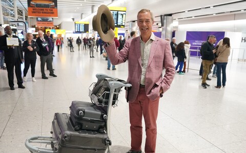 Nigel Farage arrives at Heathrow Airport this morning 