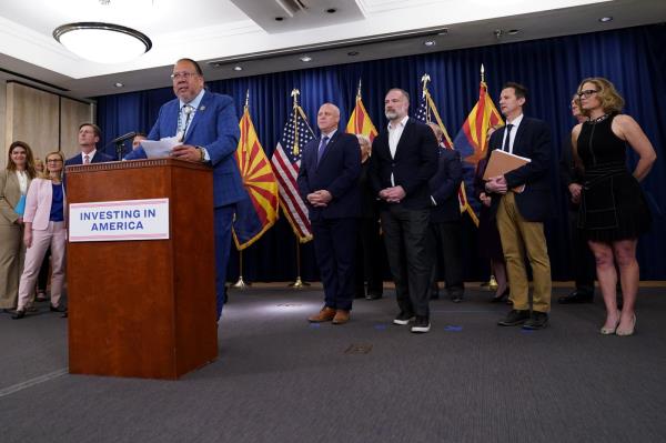 Gila River Indian Community Governor Stephen Roe Lewis, backdropped by federal, state and local officials, speaks at the Capitol, Thursday, April 6, 2023, in Phoenix. Lewis was discussing newly announced water co<em></em>nservation funding for Gila River Indian Community and water users across the Colorado River Basin aimed to protect the stability and sustainability of the Colorado River System. (AP Photo/Matt York)