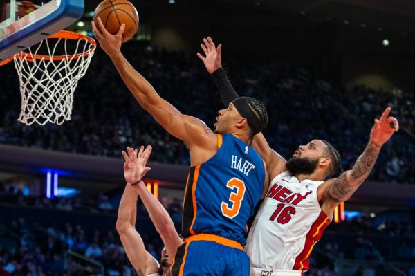 Josh Hart puts up a shot in front of Miami Heat forward Caleb Martin (16).