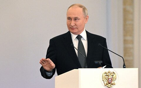 Vladimir Putin speaks during a medals ceremony for Russian soldiers in the Kremlin