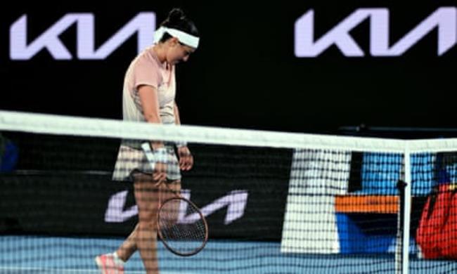 Tunisia's Ons Jabeur slumps after losing her second round match against Russia's Mirra Andreeva at the Australian Open.