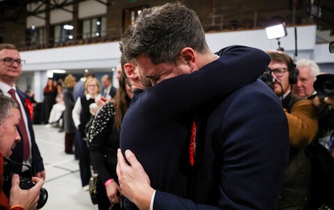 Labour Party candidate Damien Egan reacts after winning the by-election