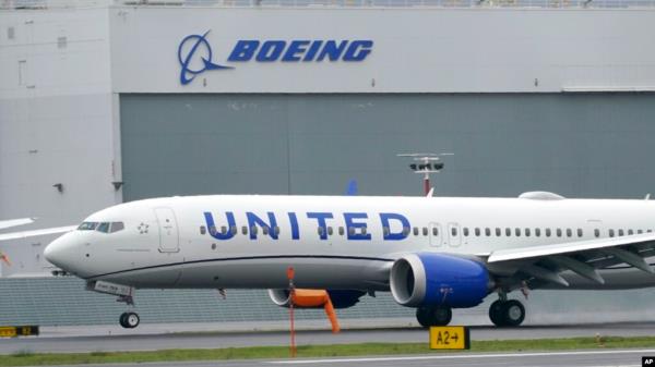 FILE - A Boeing 737 Max 9 built for United Airlines lands at King County Internatio<em></em>nal Airport - Boeing Field after a test flight, in Seattle, Nov. 18, 2020.