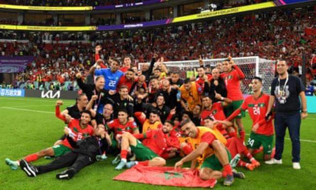 Morocco players and staff celebrate after the 1-0 win over Portugal in their 2022 World Cup quarter-final.