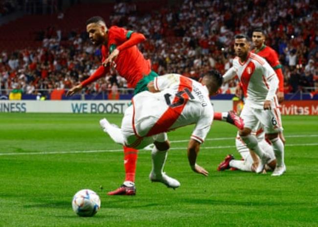 Peru’s Carlos Zambrano in action with Morocco’s Youssef En-Nesyri.