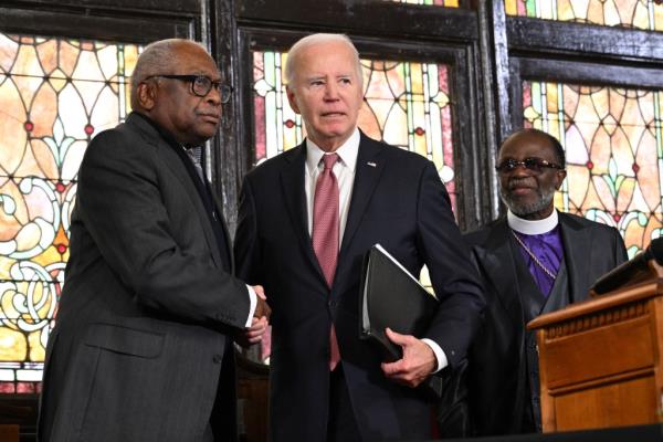 US President Joe Biden shakes hands with US Democratic Representative from South Carolina Jim Clyburn after speaking at a campaign event at Mother Emanuel AME curch in Charleston, South Carolina, on January 8, 2024.