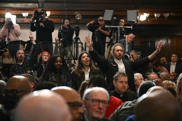 Protestors call for a ceasefire in the Gaza Strip as US President Joe Biden speaks at Mother Emanuel AME church at a campaign event in Charleston, South Carolina, on January 8, 2024. 