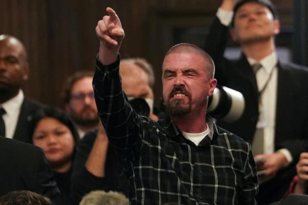 A protestor demanding a ceasefire in Gaza, gestures during U.S. President Joe Biden's speech at campaign event at the Mother Emanuel AME Church, the site of the 2015 mass shooting, in Charleston, South Carolina, U.S., January 8, 2024. 