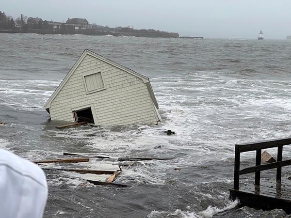 A fishing shack floats away into Casco Bay during a storm in South Portland, Maine, Saturday Jan. 13, 2024