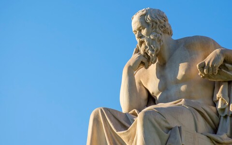 A statue of Greek philosopher Socrates in front of the natio<em></em>nal Academy of Athens