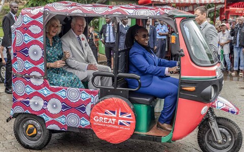 King and Queen sit in an electric rickshaw on their way to Fort Jesus in Mombasa Old Town during their state visit to Kenya