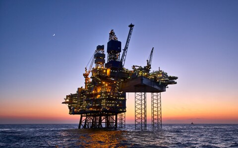 Offshore oil and gas platform on production site. Jack up rig crude oil production in the North Sea.