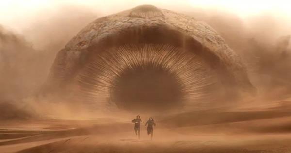 Timothee Chalamet and a sandworm in Dune