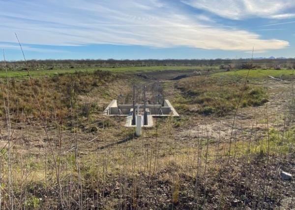 Trenching leads to River Partners' fish gate, covered by Sacramento...